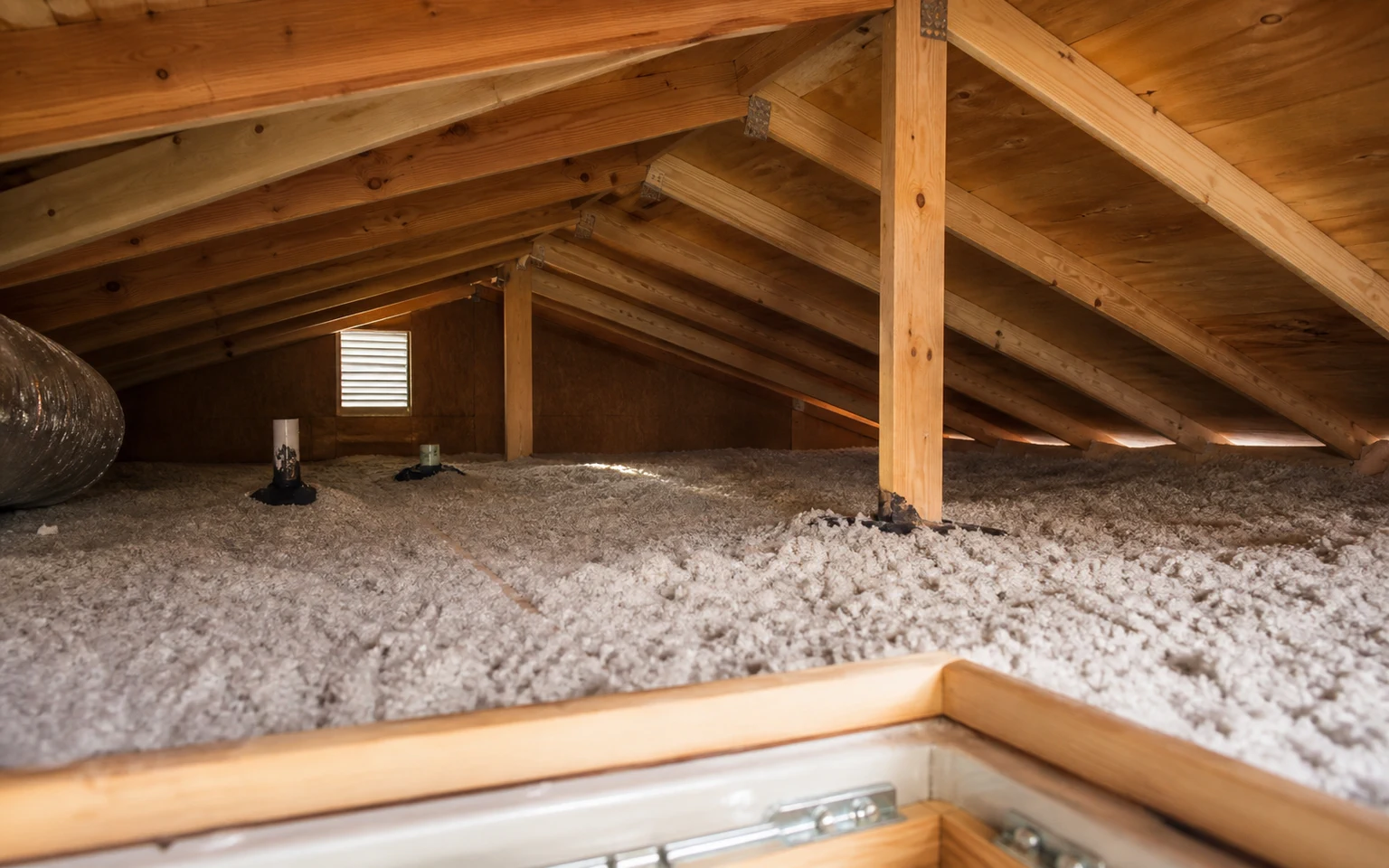 Loose-fill insulation, sealed penetrations and roof framing in a naturally ventilated residential attic